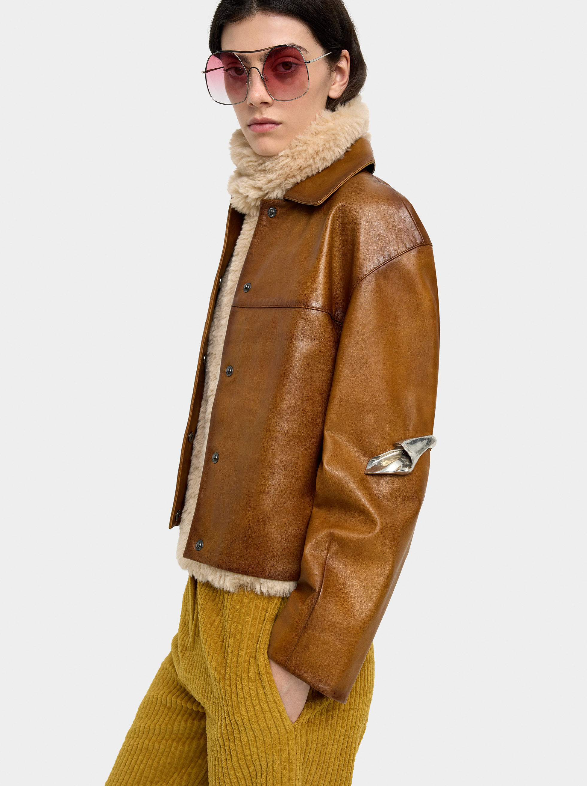 Faux fur coat with visible stitching