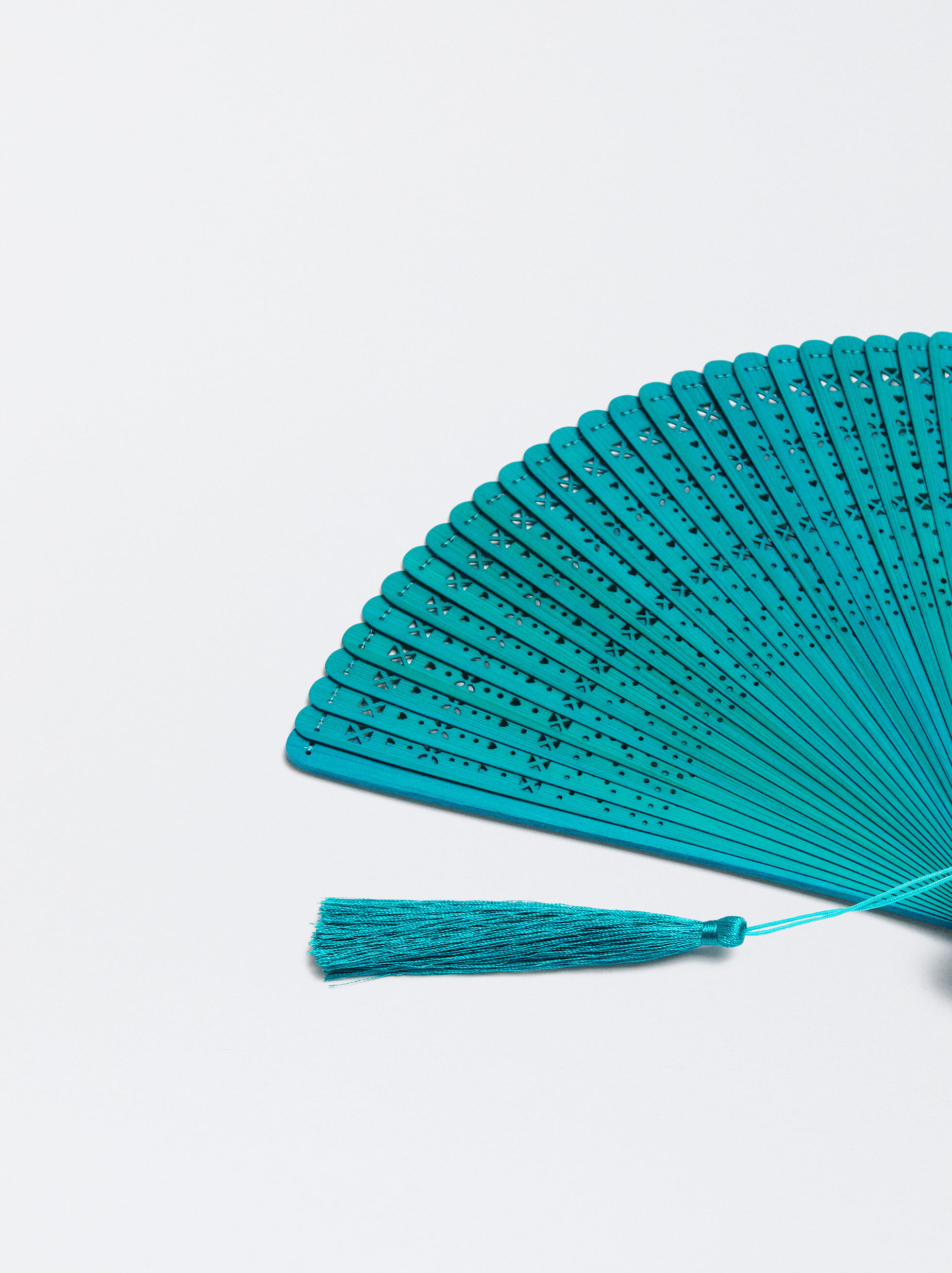 Bamboo fan with perforated design